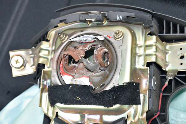 This is an example of a ruptured driver’s side Takata airbag inflator – the portion of the airbag that, when triggered, causes the airbag to inflate.