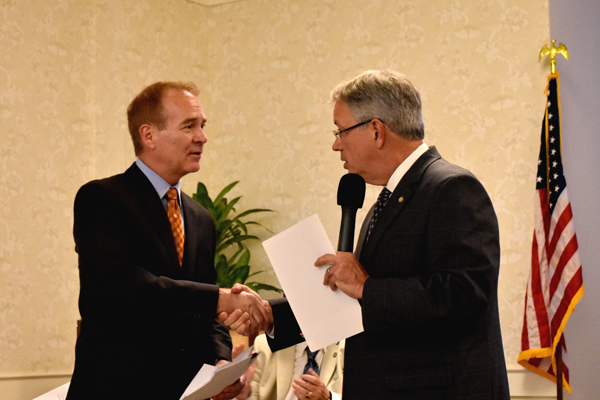 Asbestos attorney John Herrick shaking hands with Charleston Mayor John Tecklenburg 