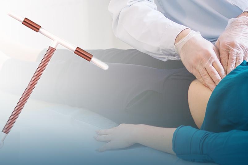 Doctor examining woman's abdomen