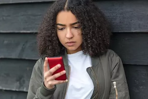 teenage girl using cell phone