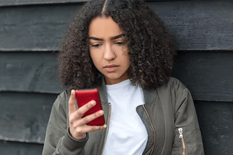 teenage girl using cell phone