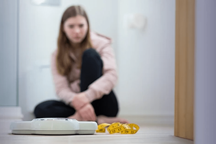 teenager and a scale