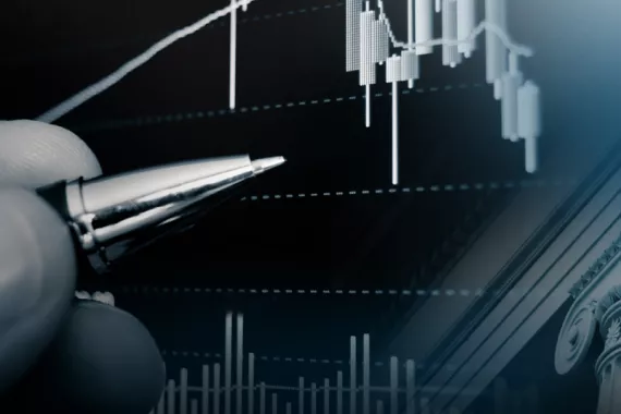 A graphic collage features a hand holding a pen that points to a stock market chart. In the background is an ornate Greek pillar.